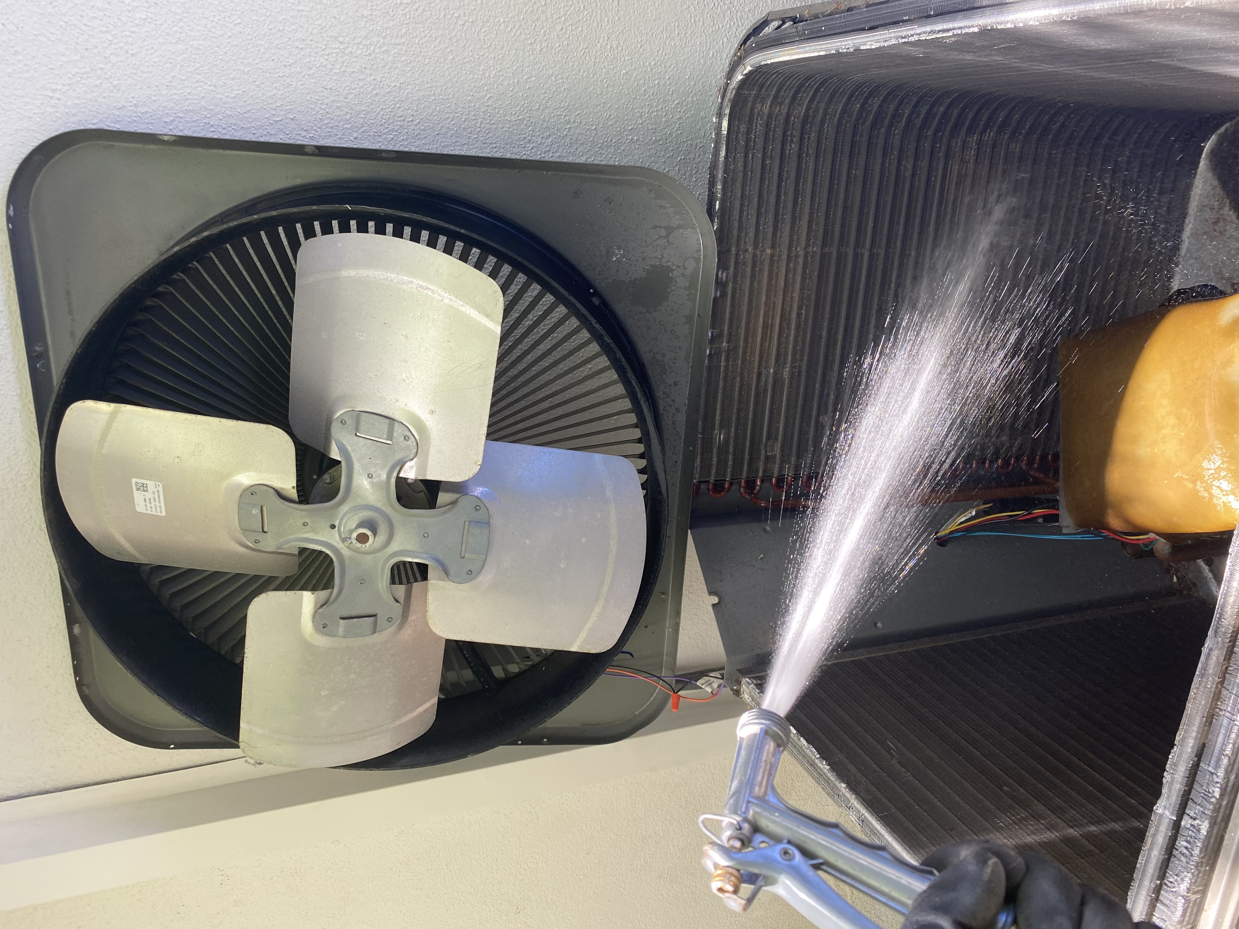 Technician servicing a commercial HVAC unit with minimal disruption to business operations